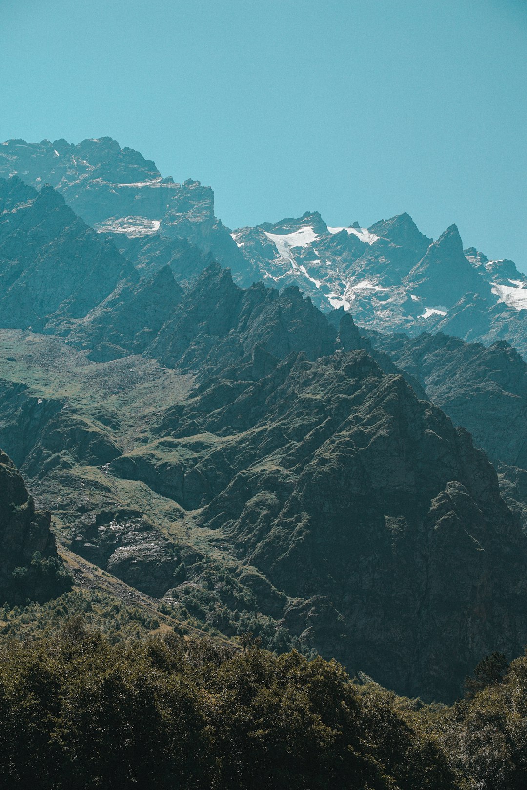 gray rocky mountain under blue sky during daytime