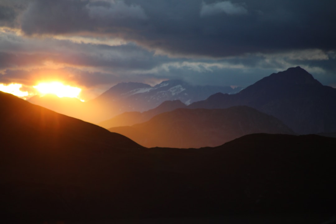 Sunset by Chile Vacay The sun is setting over a mountain range
