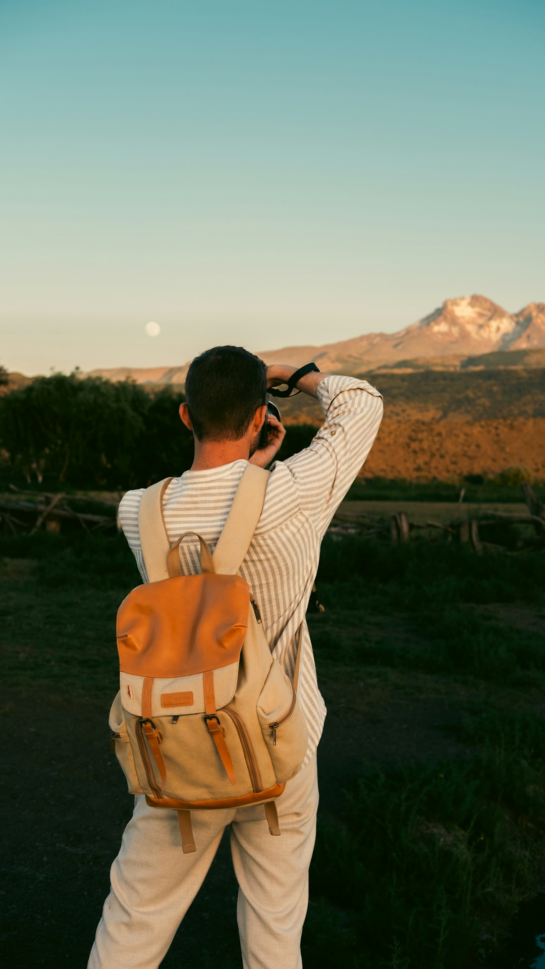 A man is taking a picture with his cell phone