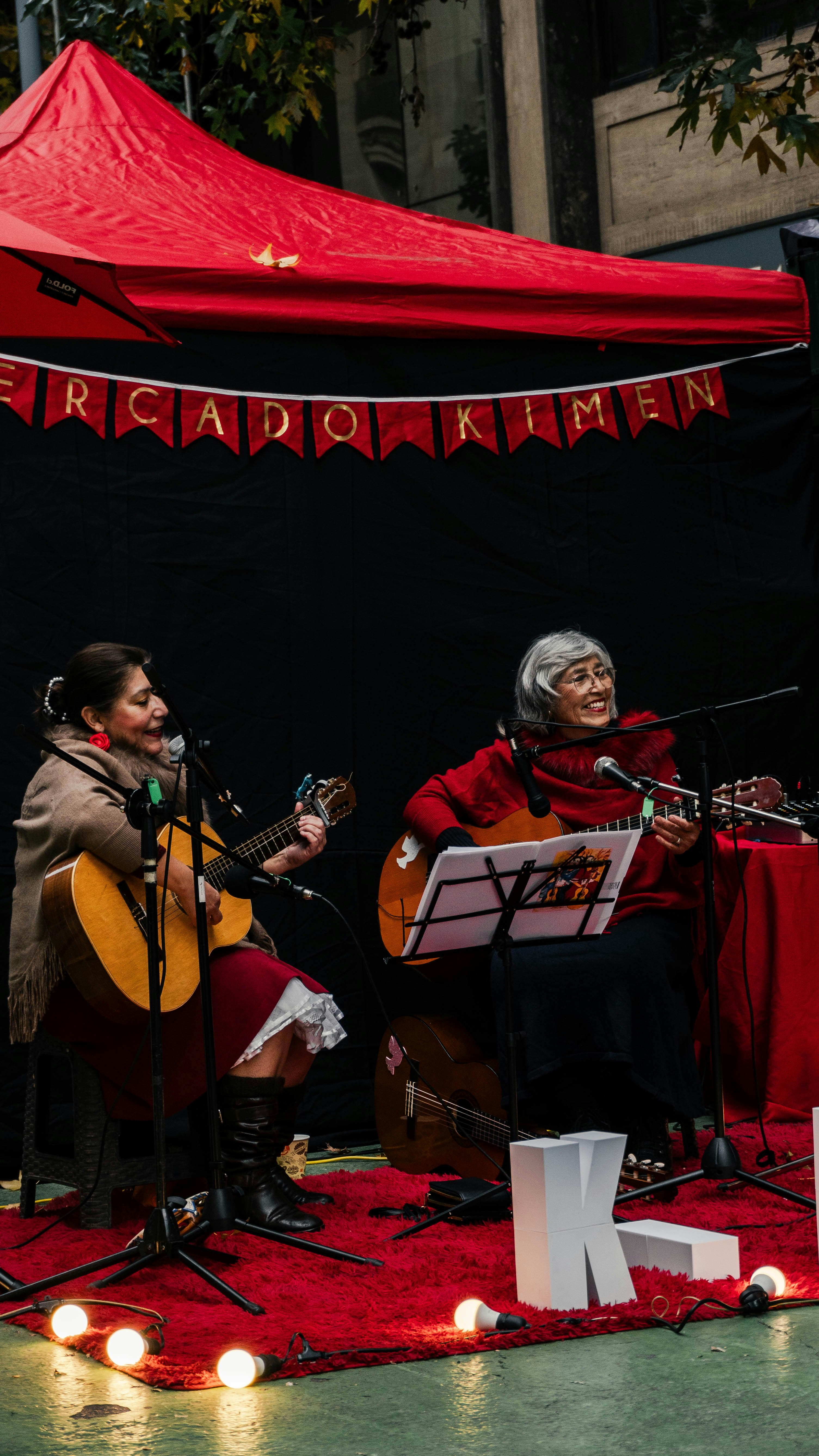 FAQ: Your Burning Questions About Chilean Musicians Answered ❓ by Chile Vacay A couple of people that are sitting on a stage