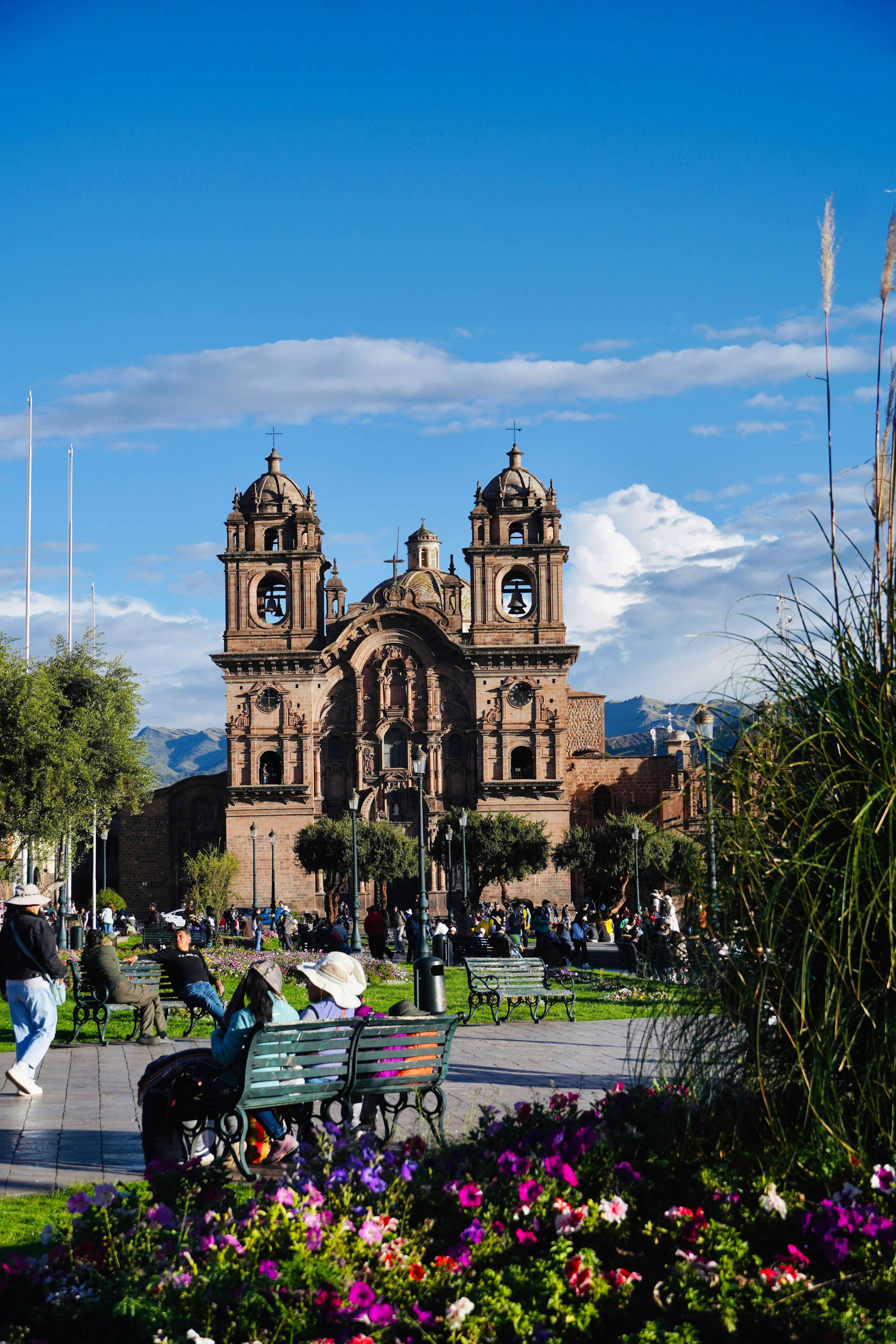 A beautiful cathedral sits in a sunny square.